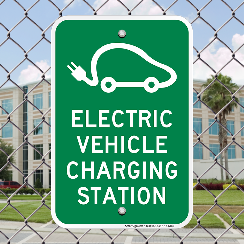 Green sign indicating an ev charging station with a car and plug icon.